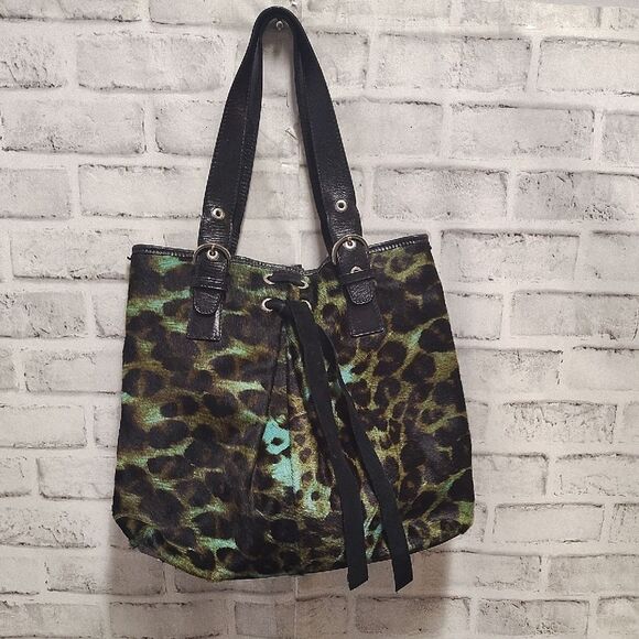 Brown and Black Shoulder Bag with Durable Fabric and Decorative Tassels - Picture 1 of 6